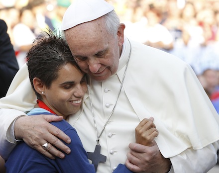 Pope embraces young woman during encounter with youth in Cagliari, Sardinia